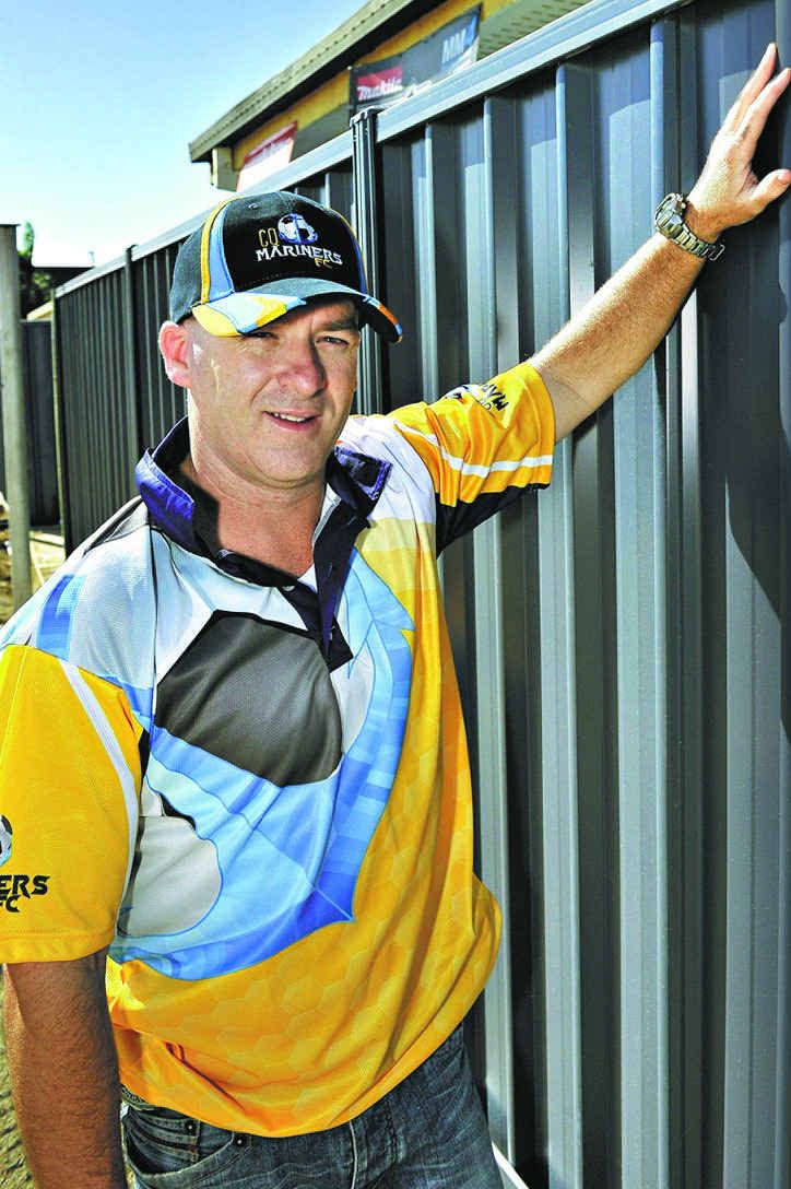 MY PANEL: Parent Chris Lindsay at the CQ Mariners Football Club with the fence panel he paid for. MY PANEL: Parent Chris Lindsay at the CQ Mariners Football Club with the fence panel he paid for.